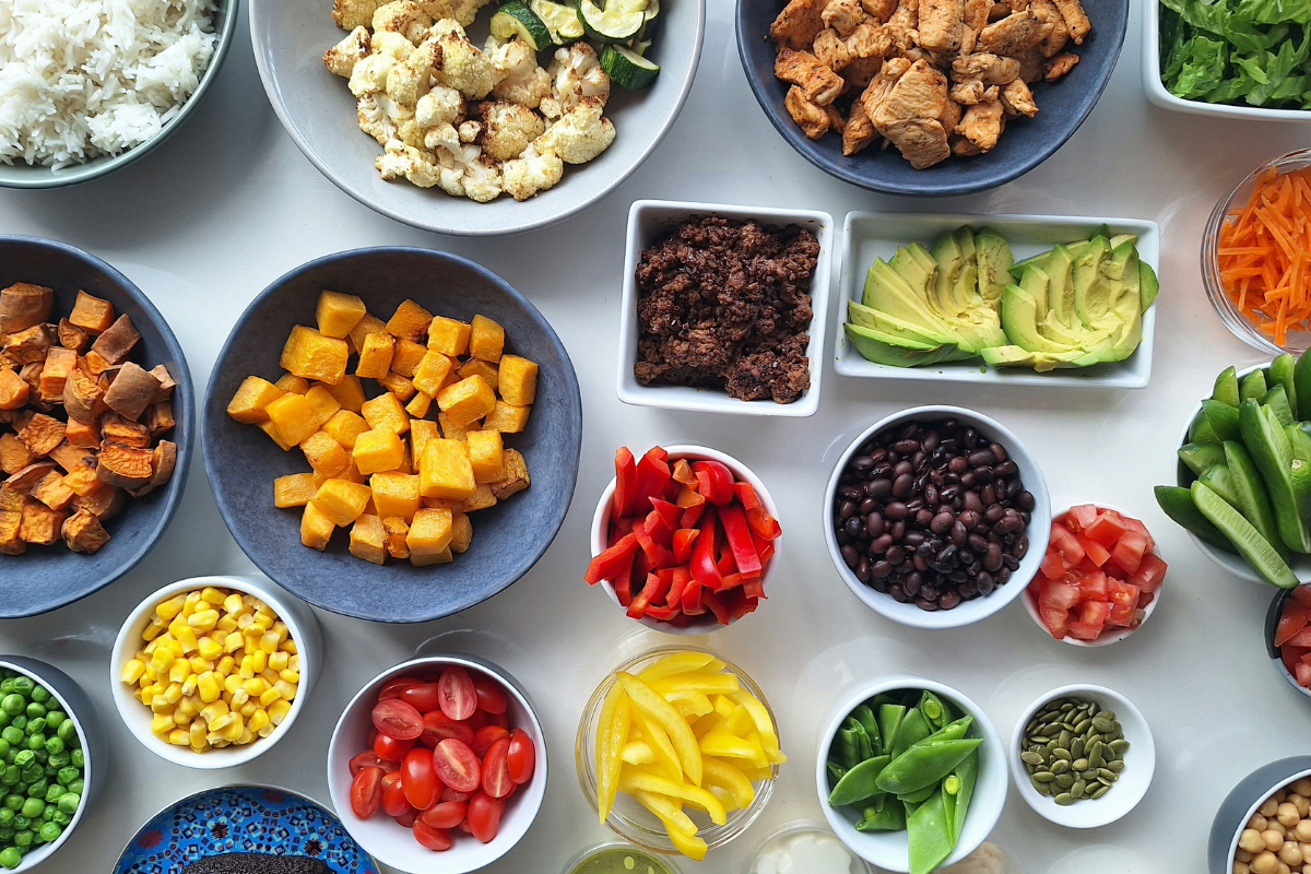 Nourish bowl ingredients: vegetables, rice, beans